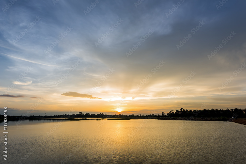 Breathtaking sunset with ripple wave in the lake and serene view