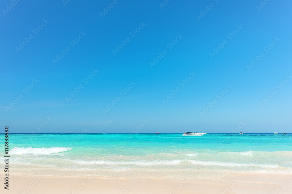 Exotic beach with gentle wave and clear on beach with blue sky