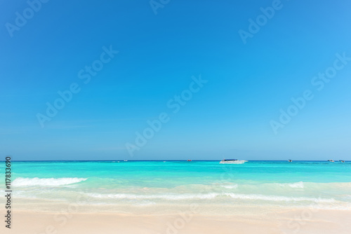 Exotic beach with gentle wave and clear on beach with blue sky © peangdao