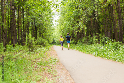 Wallpaper Mural fitness, sport, friendship and lifestyle concept - smiling couple running outdoors. Torontodigital.ca
