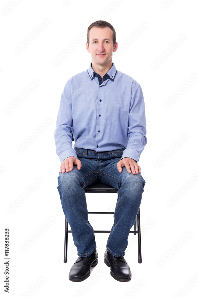 young man sitting on office chair isolated on white young man sitting on office chair isolated on white