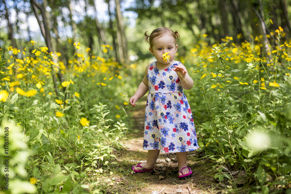 Little girl in the forest park