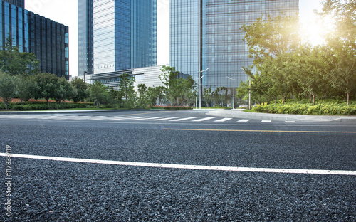 city empty traffic road with cityscape in background