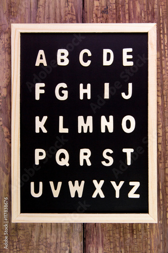Wooden english alphabet A-Z on the blackboard.on wooden table.