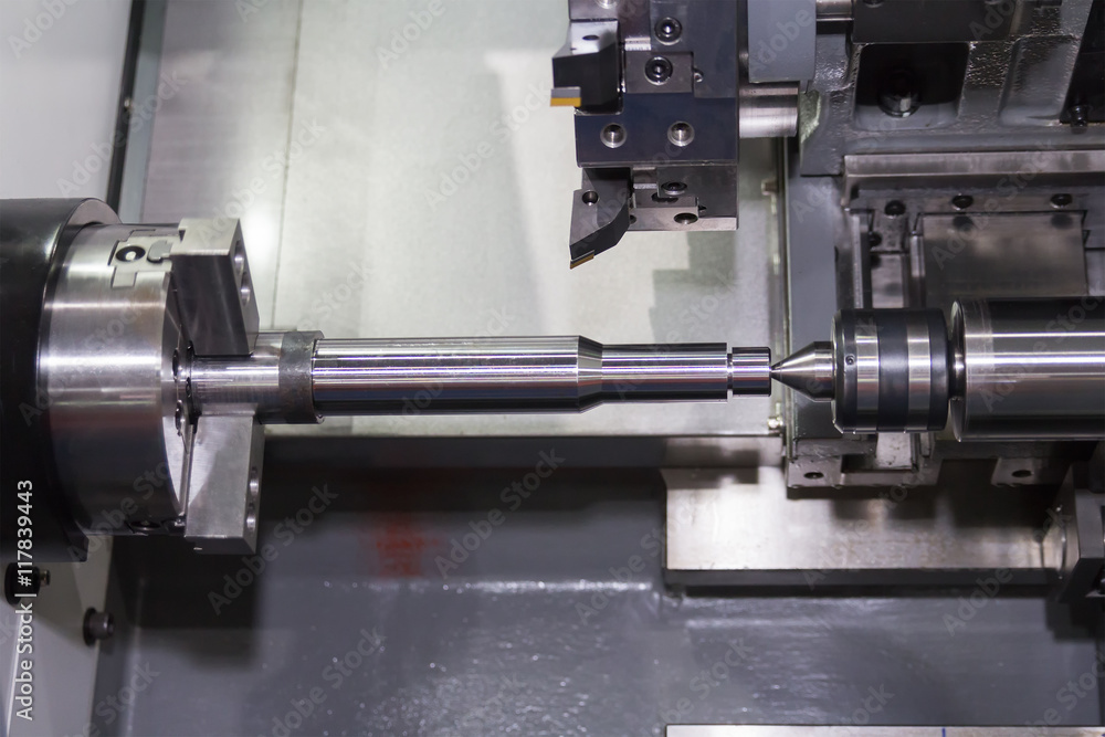 Steel metal cutting machine process by CNC lathe in workshop Steel metal cutting machine process by CNC lathe in workshop