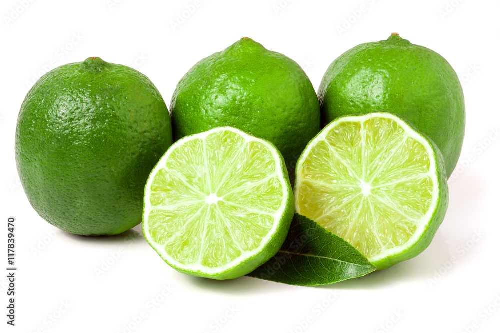 three limes with halves and leaf isolated on white background three limes with halves and leaf isolated on white background