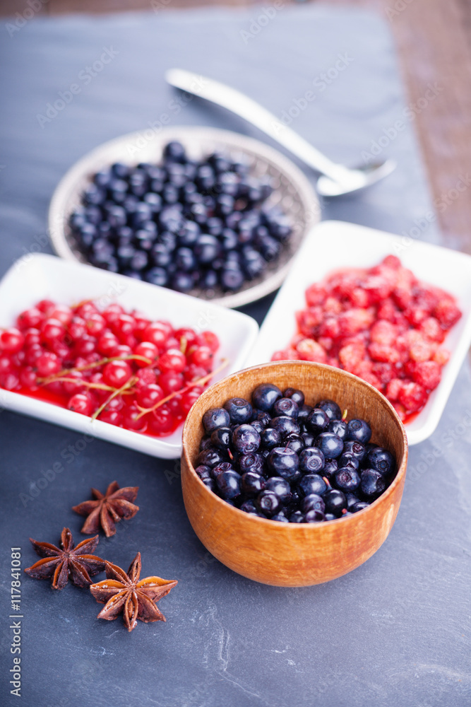 Berry fruits in bowls and dishes Berry fruits in bowls and dishes