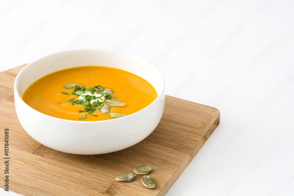 Pumpkin soup with cream and pumpkin seeds isolated on white background
Pumpkin soup with cream and pumpkin seeds isolated on white background
