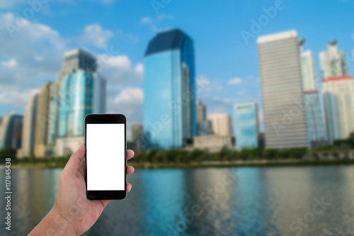 man hand holding the phone and white screen with blur background