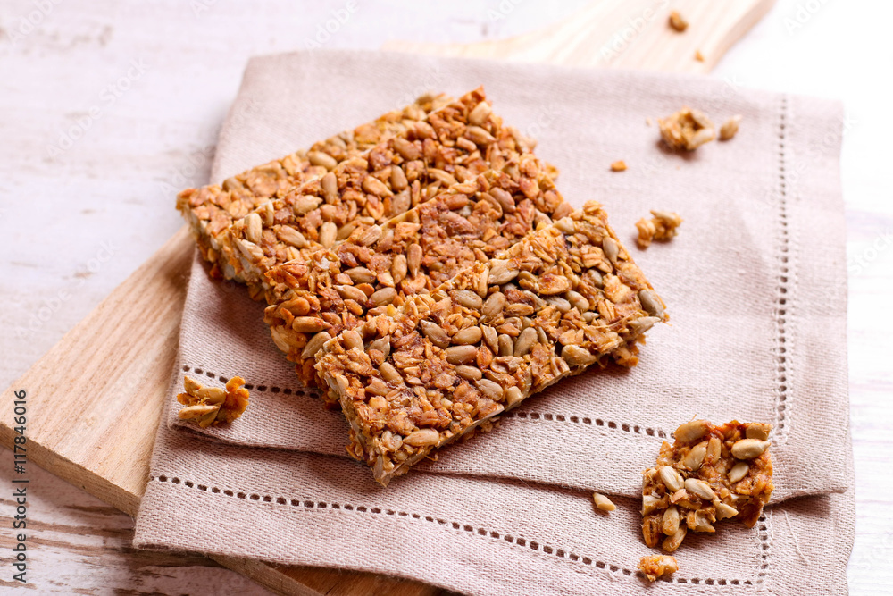 Healthy granola bar on wooden background