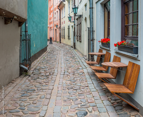 Narrow medieval street in old Riga that is the capital of Latvia and famous Baltic city known of its medieval architecture. 