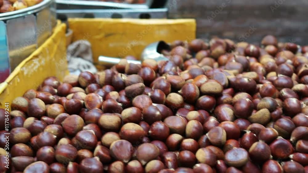 Roasted chestnut, pine nut peeled and corn on street food stall. Autumn food of Asia Roasted chestnut, pine nut peeled and corn on street food stall. Autumn food of Asia