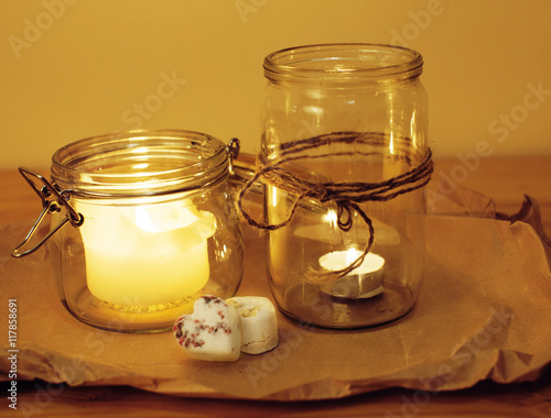 candles in glass burning romantic celecration concept wooden kitchen photo