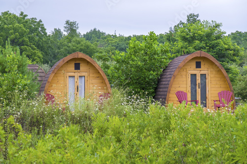Little Wooden Huts For Overnight Stay in a Summer Camping Ground © chiyacat