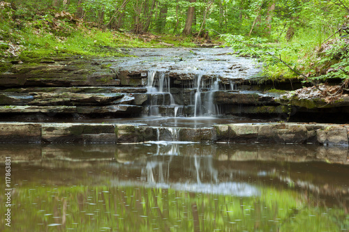 Small waterfall deep in the woods photo