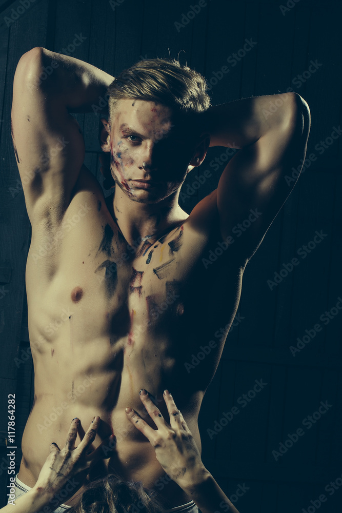 Muscular paited man and hands