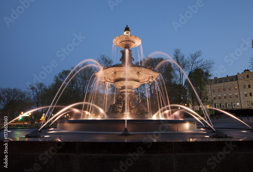  In front of the Parliament Building, Fontaine de Tourny's 43 water jets, arresting masks, and graceful figures immediately draw the eye.  photo