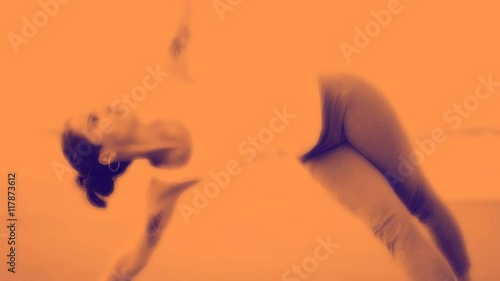 woman practices yoga at the beach photo