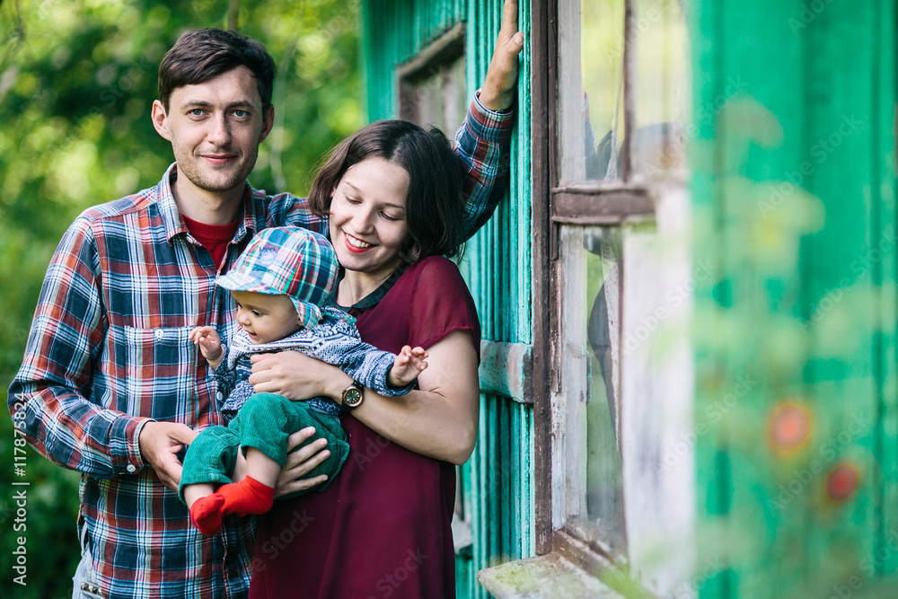 Obraz premium young family with a child on the nature