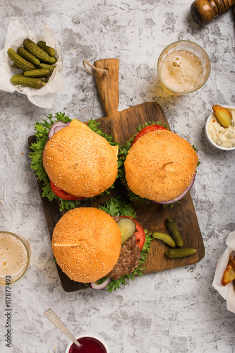 Different fresh homemade burgers with lager beer