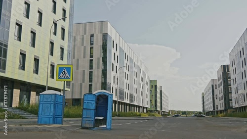 Blue public toilets at empty street of innopolis city, photo