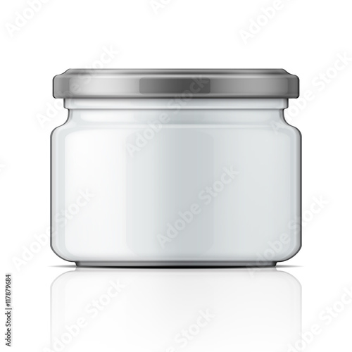 Empty glass jar with screw cap.
