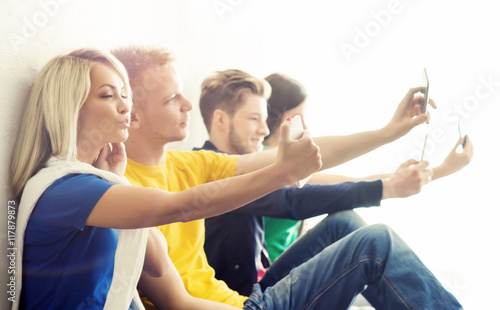 Group of hipsters taking a selfie on a break at school.