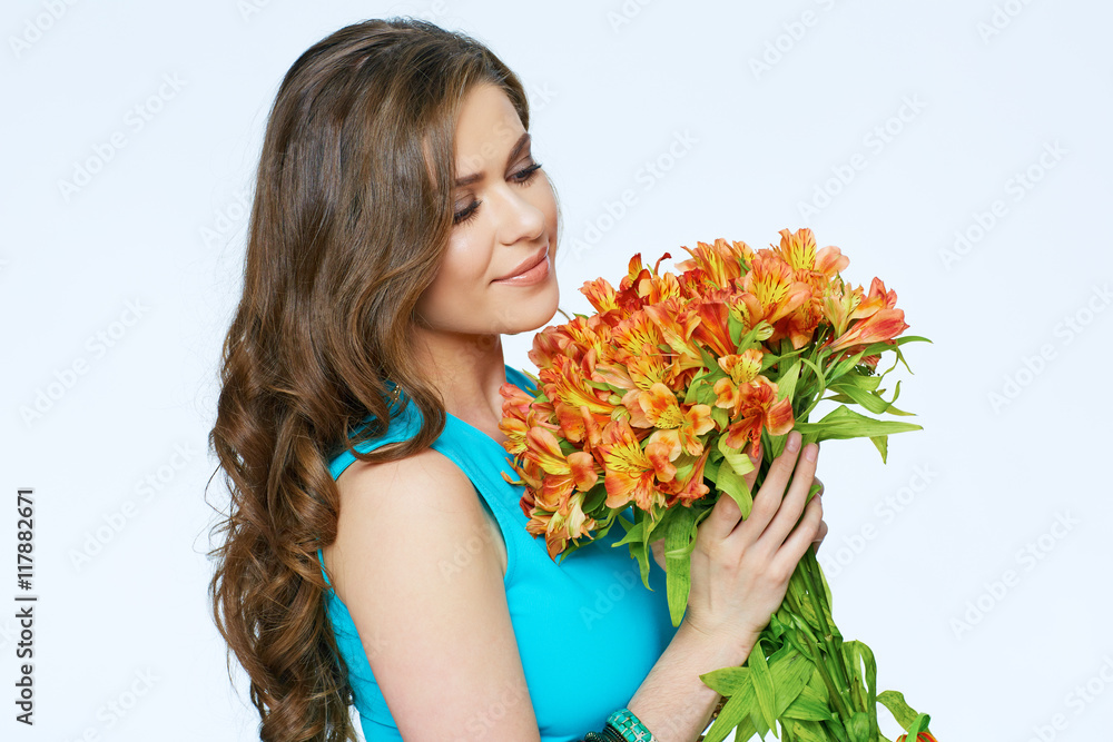 Close up face portrait of young woman with flowers.