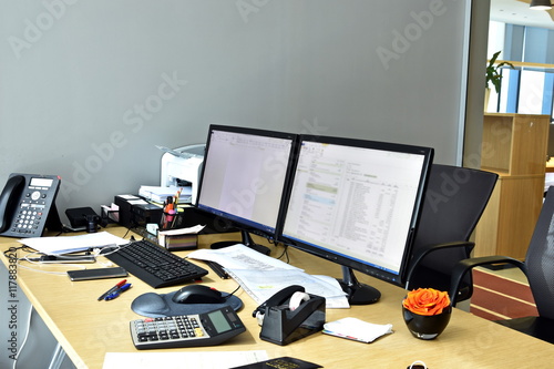 busy office desk with all items at the work