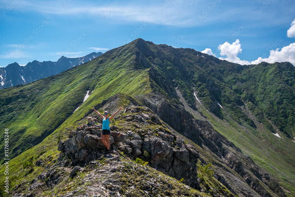 girl standing at the top of the pass Arshansky
