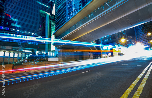 blurred traffic in downtown district,hong kong,china.Chinese characters on road are all traffic roadmarking. © kalafoto