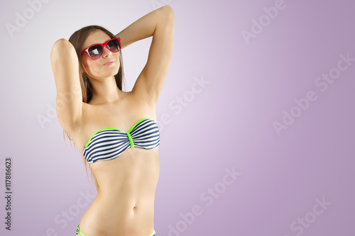 Blonde girl in striped bikini © fotofabrika
