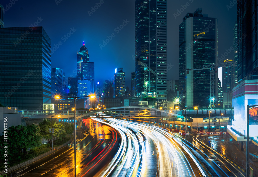 Fototapeta premium blurred traffic in downtown district,hong kong,china.Chinese characters on road are all traffic roadmarking.