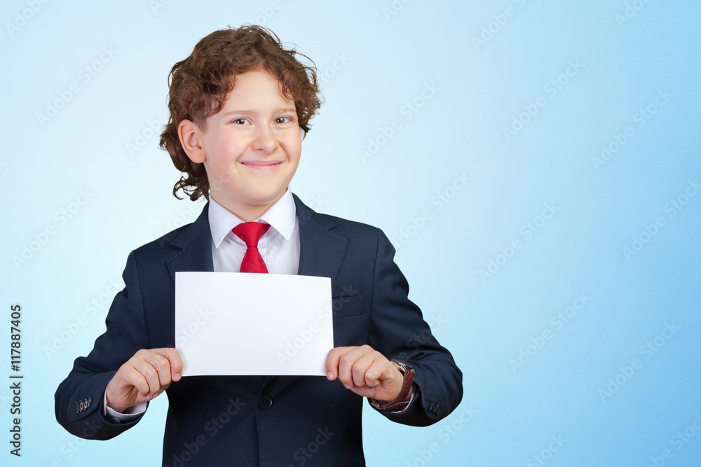 smiling boy holding blank paper smiling boy holding blank paper