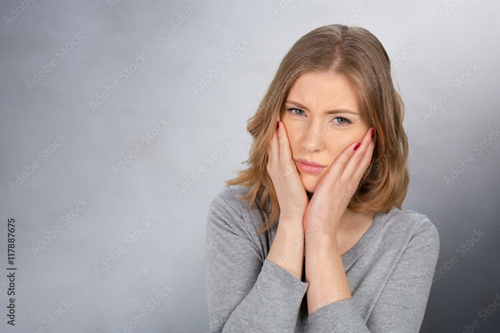 Portrait of young woman with toothache Portrait of young woman with toothache