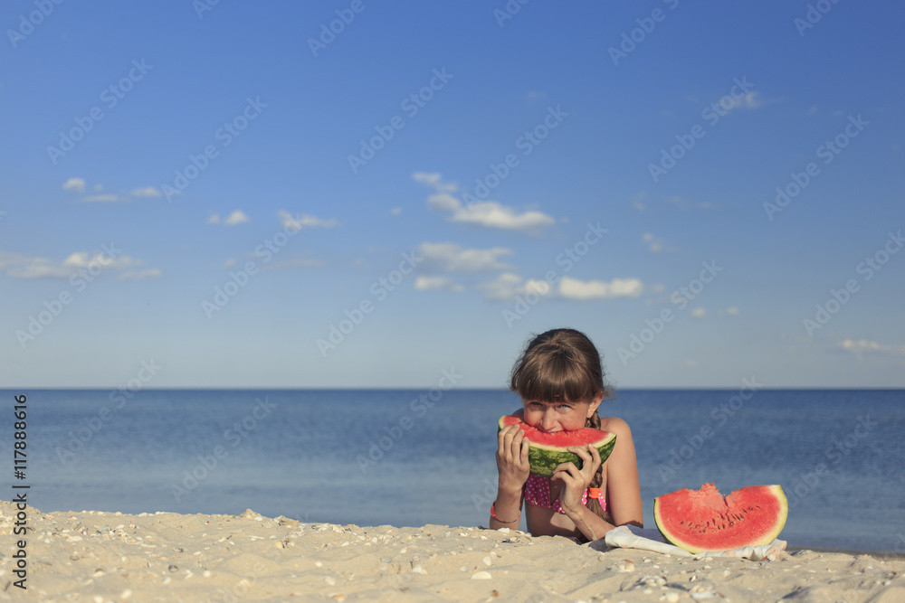 Happy children on the beach eating sweet watermelon. Happy children on the beach eating sweet watermelon.