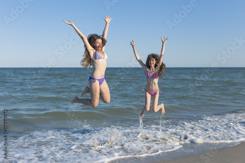 Happy children in the summer on the beach.