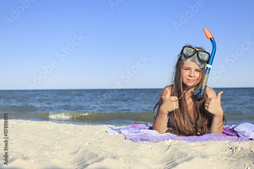 Girl with mask and snorkel for scuba diving.