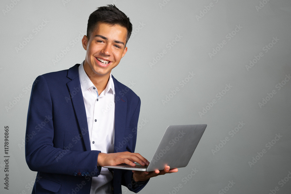 Portrait of smiling young man with laptop Portrait of smiling young man with laptop