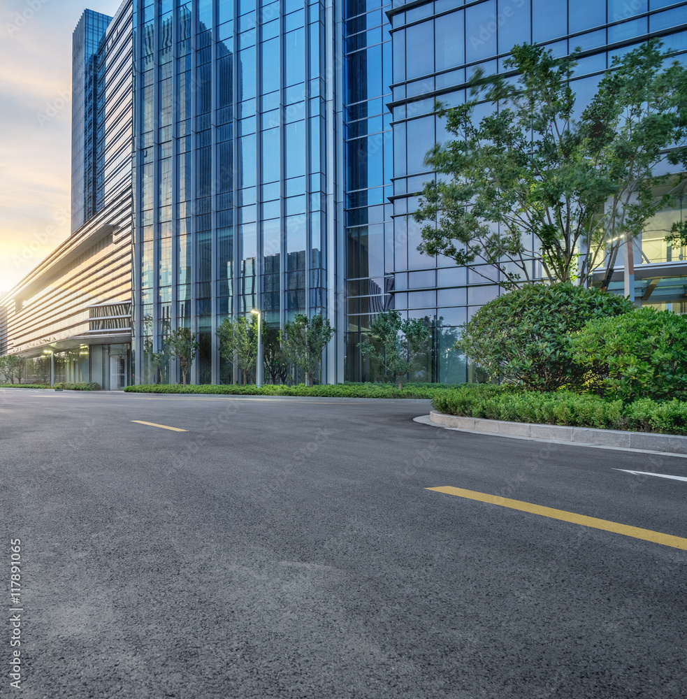 Fototapeta premium city empty traffic road with cityscape in background
