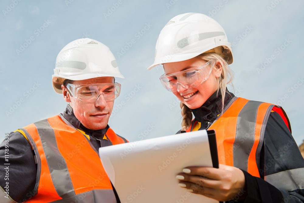 Two people working Two people working