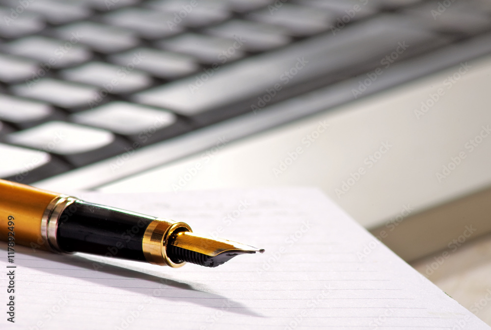 image of pen on keyboard background closeup image of pen on keyboard background closeup