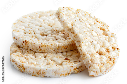 Pile of two and half puffed rice cakes isolated on white.