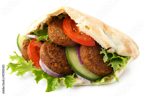 Pita bread filled with falafel and salad isolated on white.