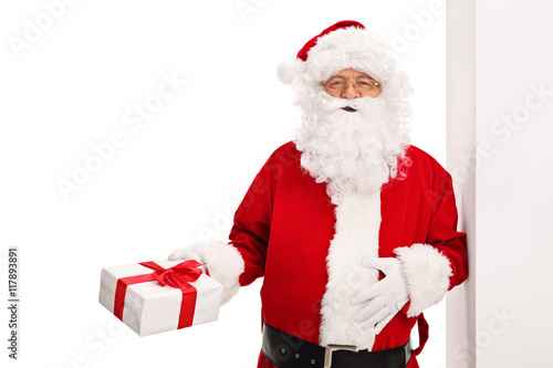 Santa Claus leaning against a wall