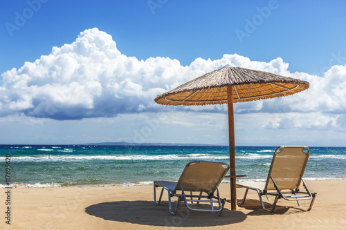 Beach chairs under a canopy. Zakynthos. Greece