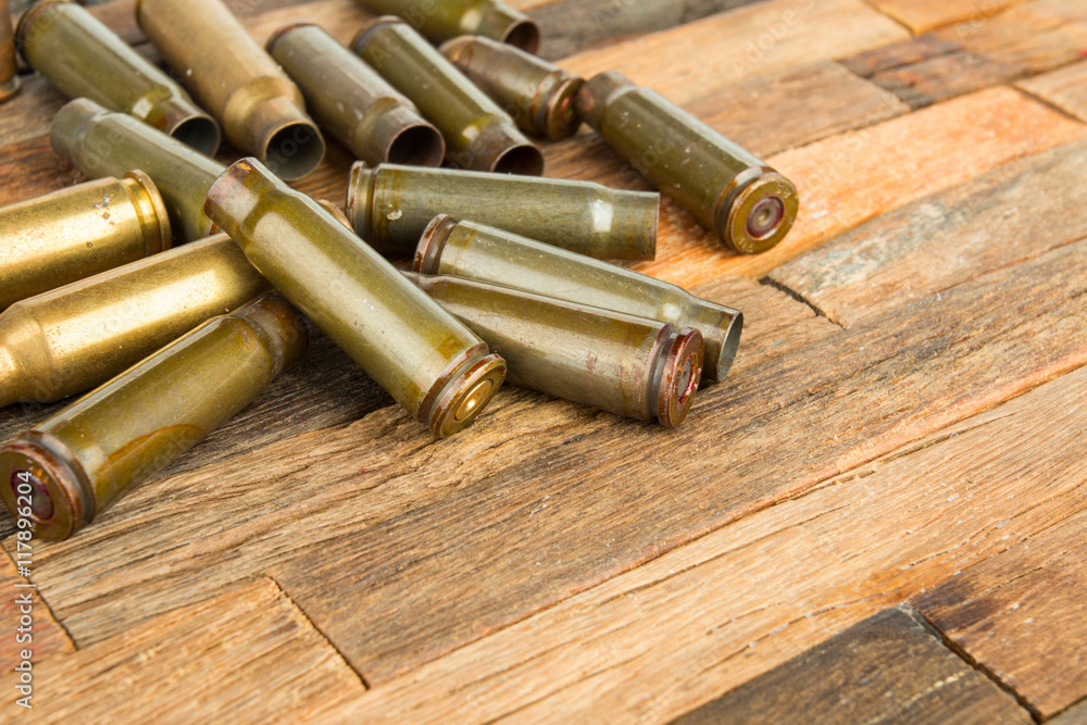 Bullets shell on wooden background.  Stock image macro.