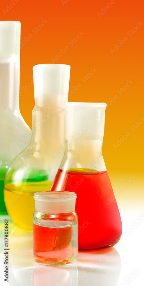 microscope and flasks with liquid in laboratory closeup microscope and flasks with liquid in laboratory closeup