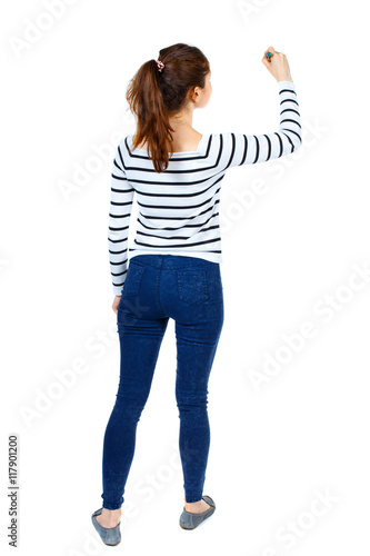 back view of writing beautiful woman. Rear view people collection.  backside view of person. Isolated over white background. Girl in a striped sweater thoughtfully draws a pen. photo