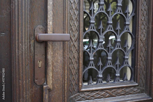 Rustic wooden door with iron handle.